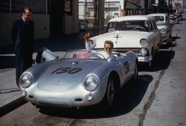 September 1955, Hollywood, Los Angeles, California, USA --- Actor James Dean gives a thumbs-up sign from his Porsche 550 Spyder, the Little Bastard, while parked on Vine Street in Hollywood. Dean, who had taken up racing the year before, owned the car only nine days when he lost his life in a fatal highway accident while driving the Porsche to a Salinas race. --- Image by © Bettmann/CORBIS